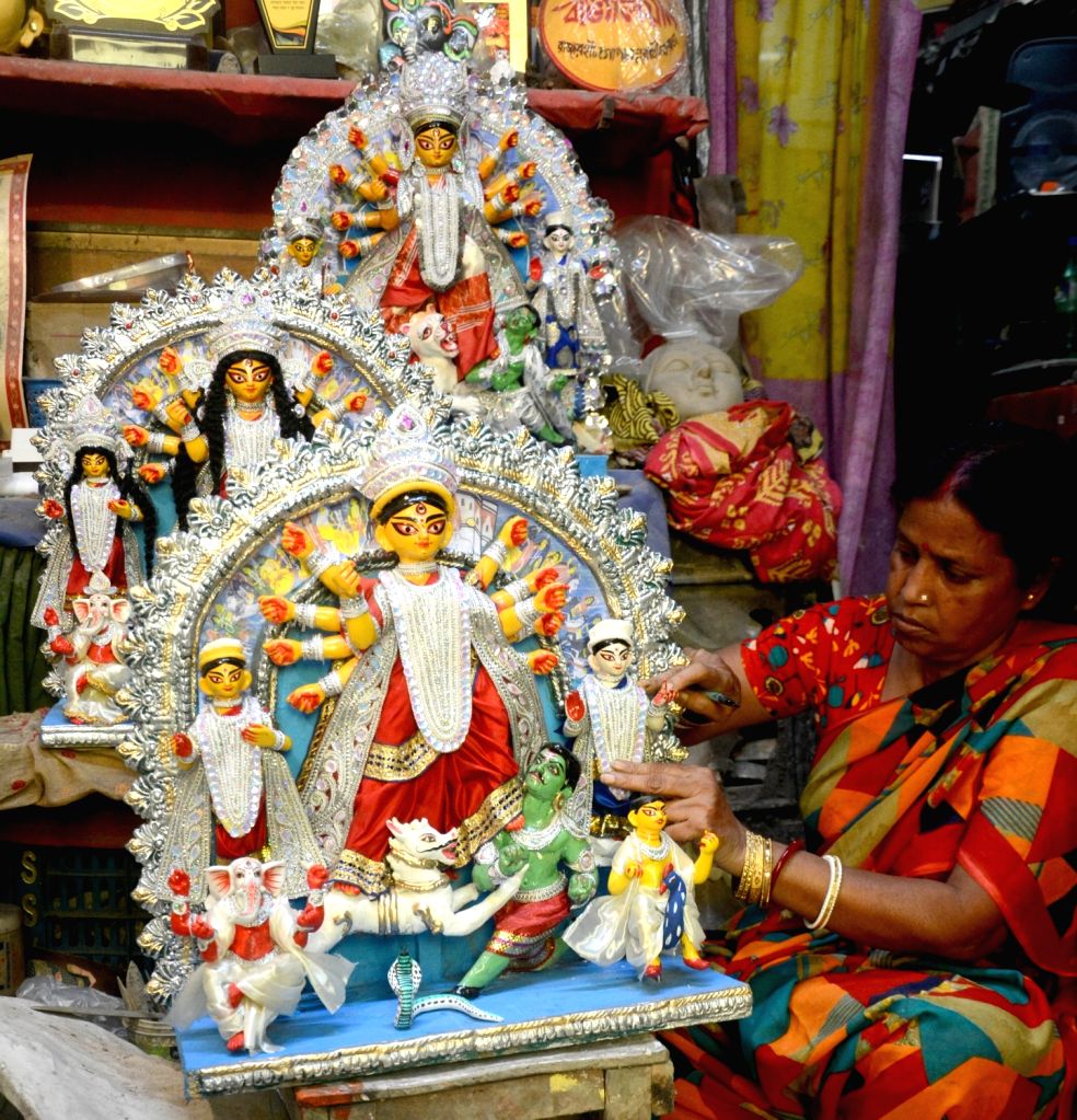 Artist Mala Paul Gives Finishing Touches To An Idol Of Goddess Durga Artist Mala Paul Gives Finishing Touches To An Idol Of Goddess Durga