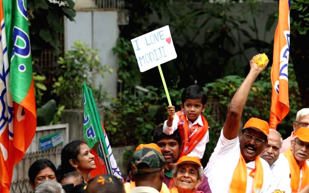 Bengaluru : Supporters of PM Narendra Modi during a roadshow