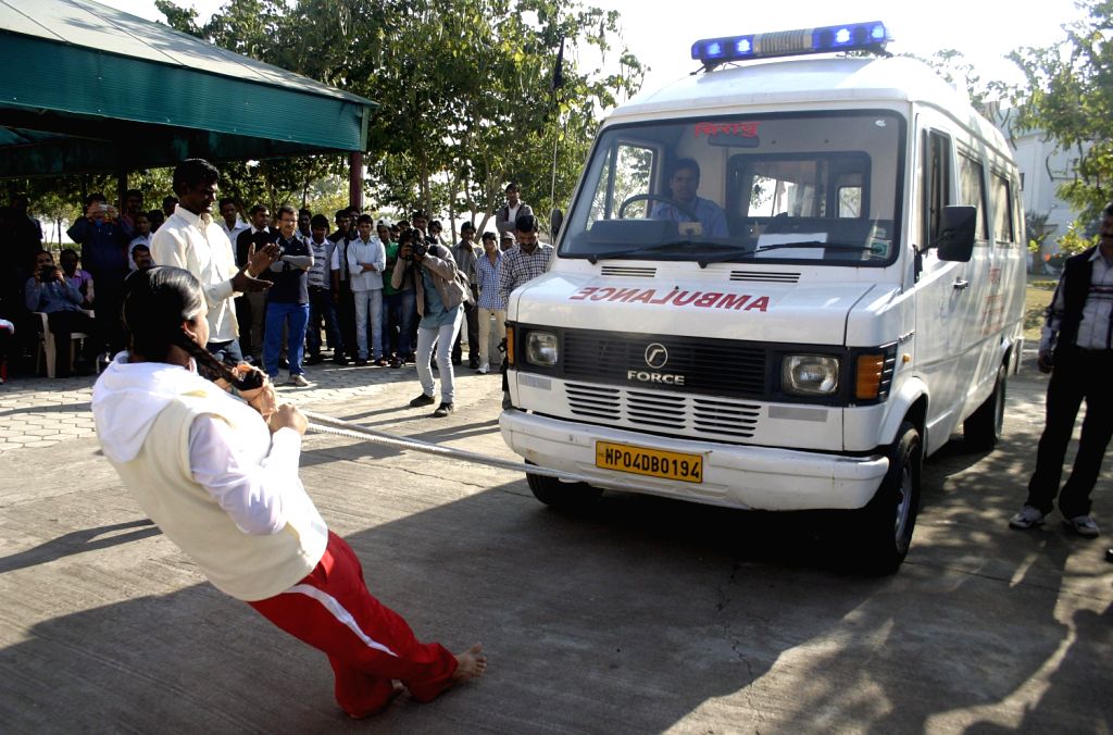 Brahma Kumari Rani Raikwar pulls an ambulance with her hair