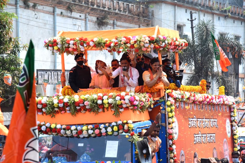 Chief Minister of Uttar Pradesh Yogi Adityanath at a roadshow ahead of ...