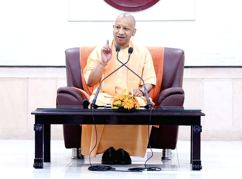 :Lucknow: Chief Minister Of Uttar Pradesh Yogi Adityanath speaks with ...