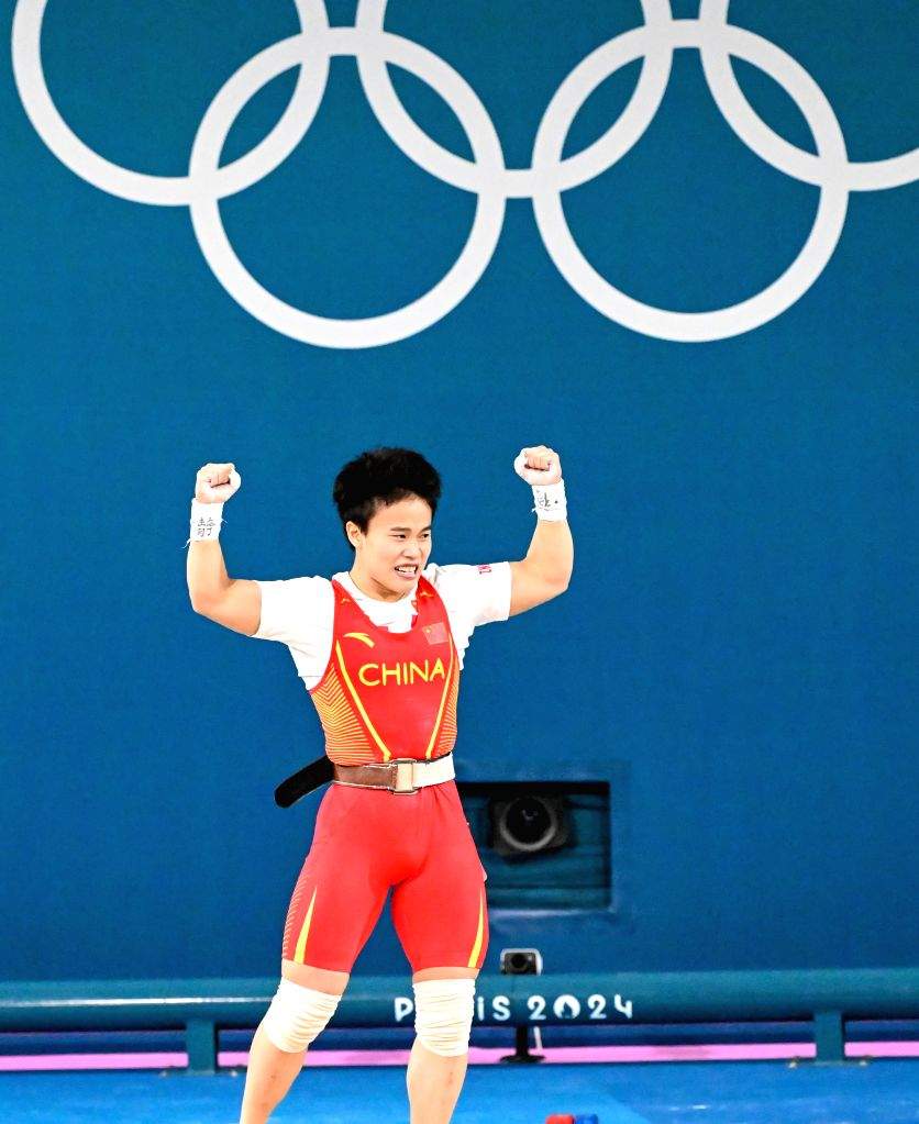 China's Hou Zhihui celebrates winning the gold medal in the women's ...