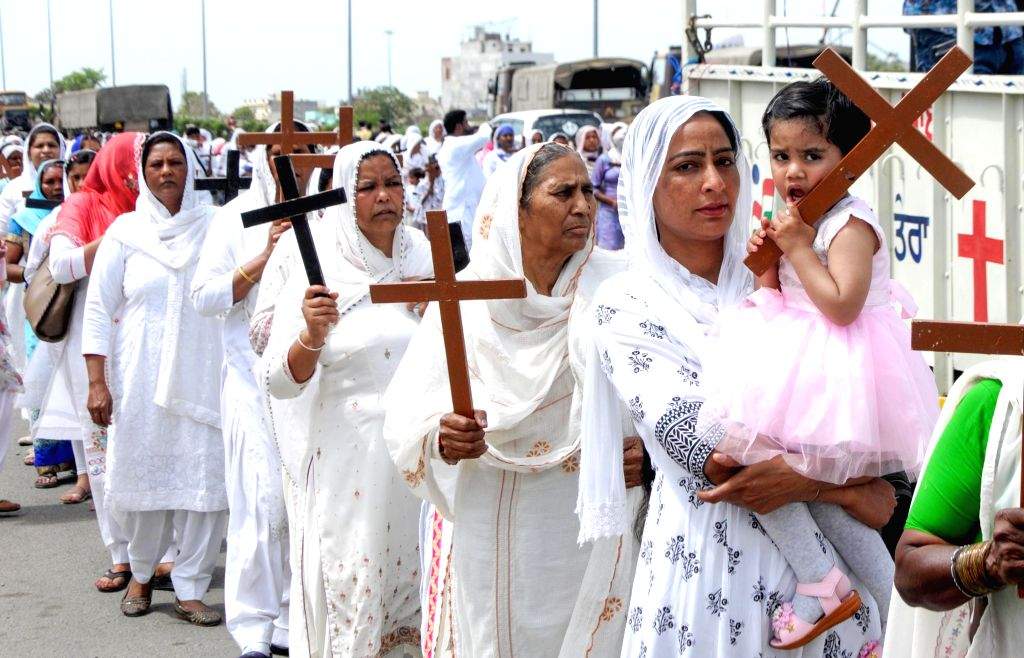 Christian devotees take part in a procession marking 'Good Friday