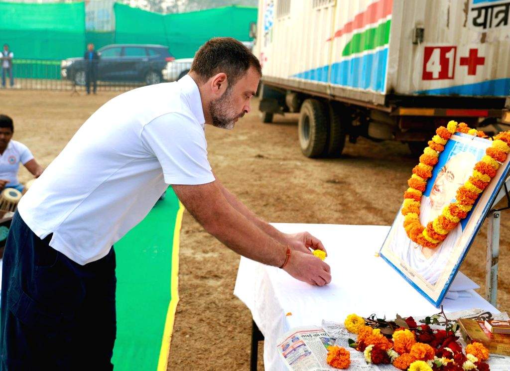 Congress leader Rahul Gandhi pays floral tribute to Mahatma Gandhi on ...