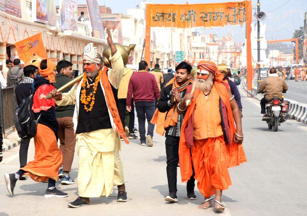 Devotees arrive ahead of the consecration ceremony of Ram Mandir