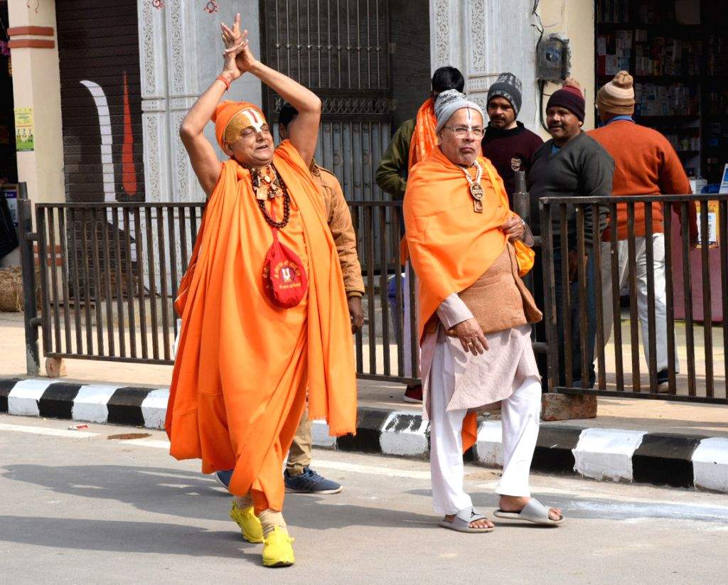 Devotees arrive ahead of the consecration ceremony of Ram Mandir