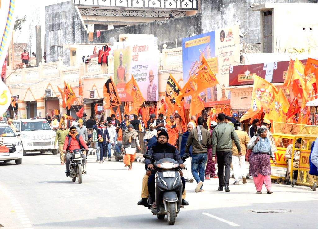 Devotees arrive ahead of the consecration ceremony of Ram Mandir