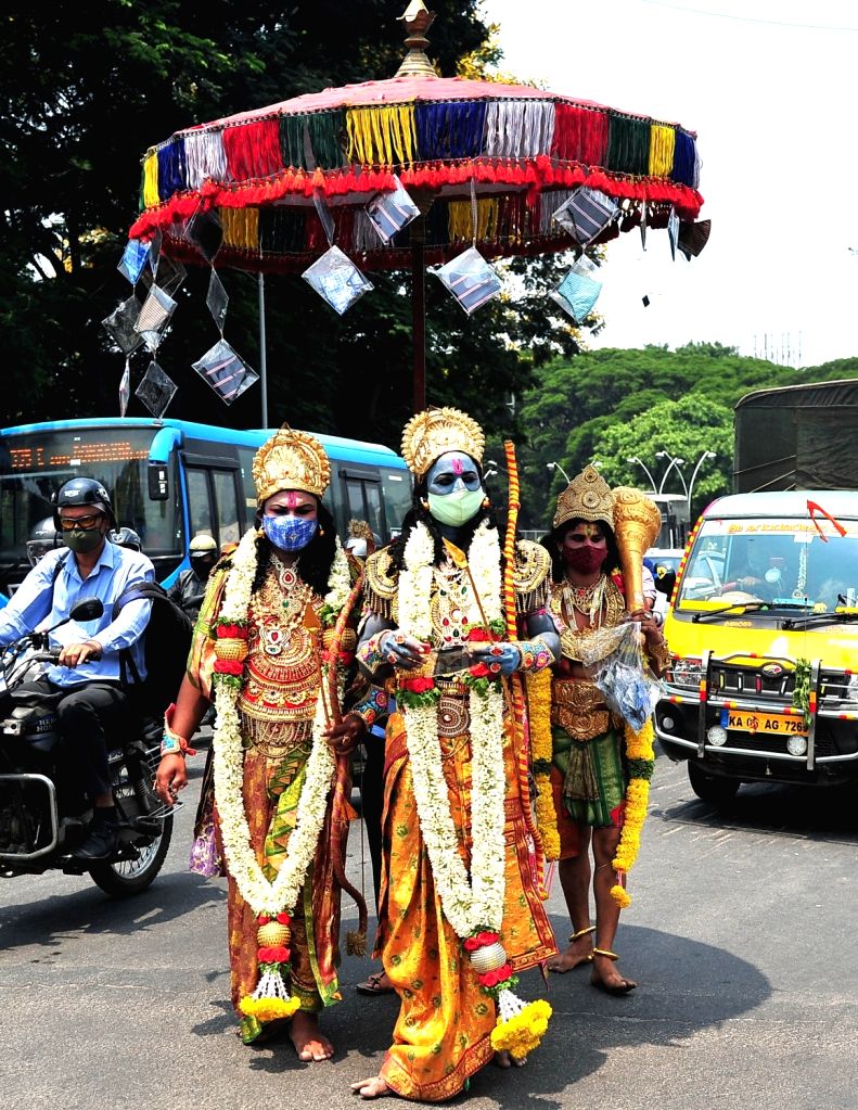 Devotees dressed like Lord Sri Rama and Lord Hanuman distribute face ...
