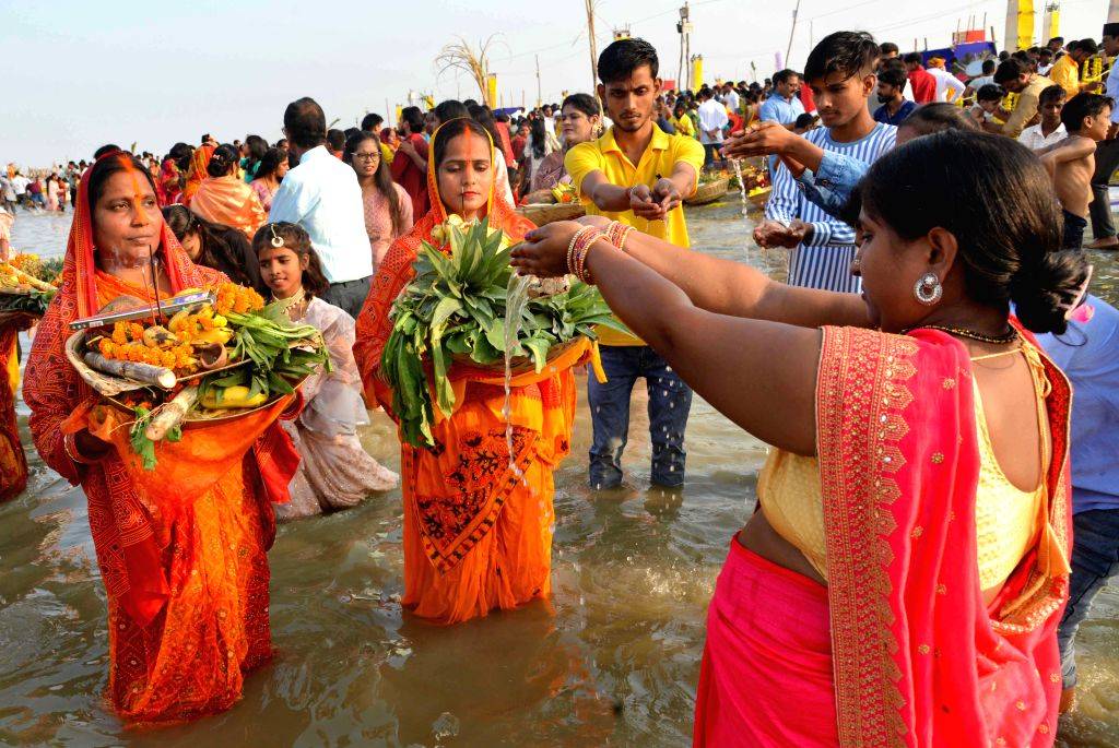 Devotees offer prayers on the banks of the Ganga River on the occasion ...