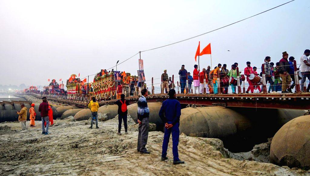 Devotees take part in a religious procession for the Maha Kumbh Mela 2025