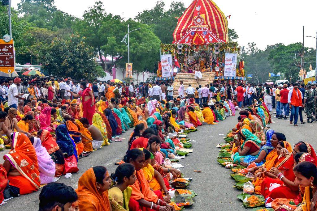 Devotees take part in a religious procession on the occasion of the ...