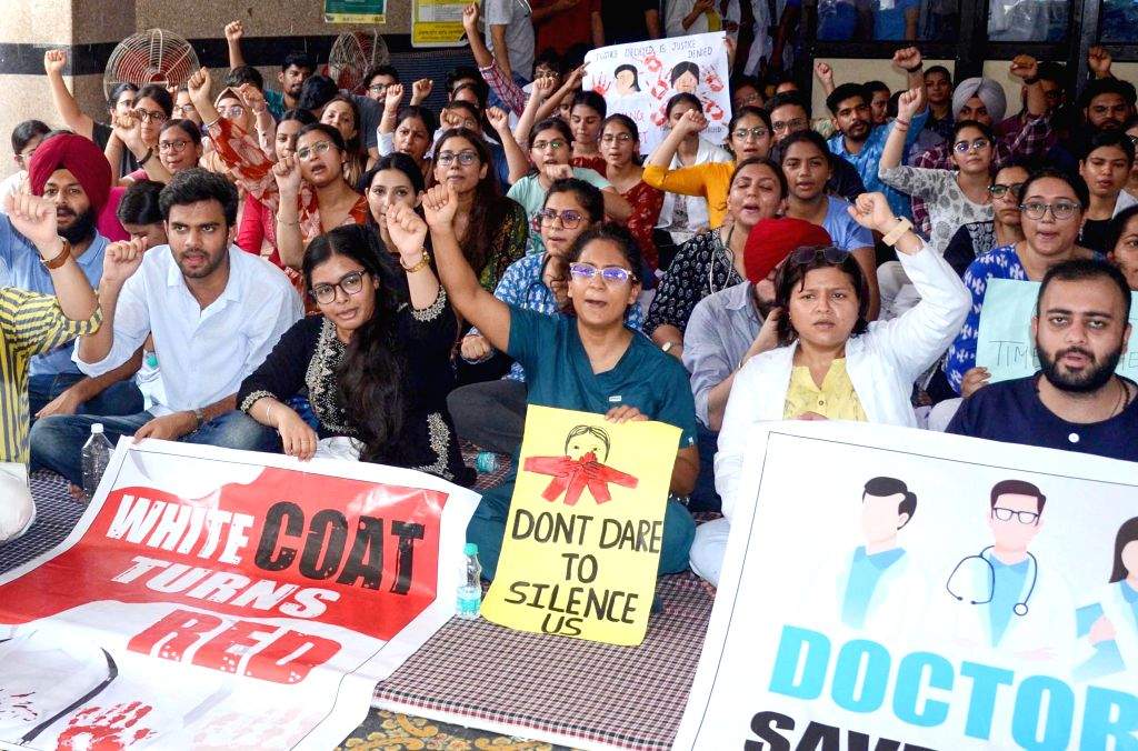 Doctors stage a protest against the rape and murder of a young medic at ...