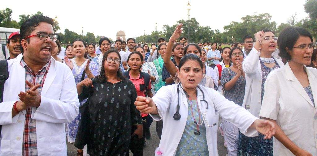 Doctors stage a protest march against the rape and murder of a young medic