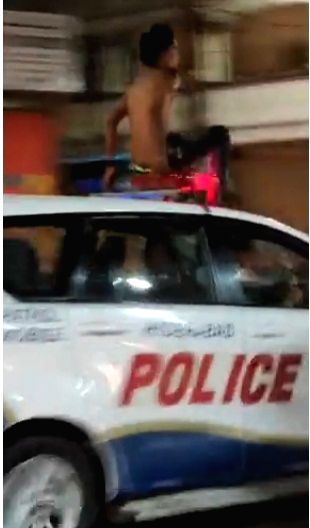 Drunk man hops on to moving police vehicle in Hyderabad