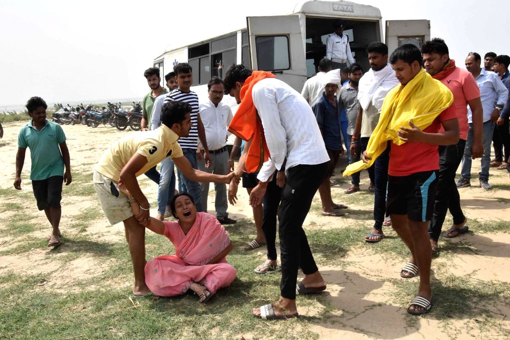 Family members of six boys who drowned while bathing in river Ganga