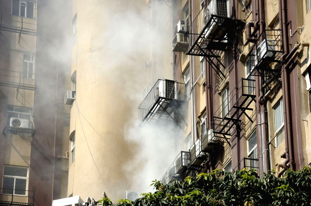 Firefighters fighting against fire at a multi storey building in Kolkata.