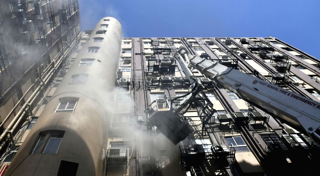 Firefighters fighting against fire at a multi storey building in Kolkata.