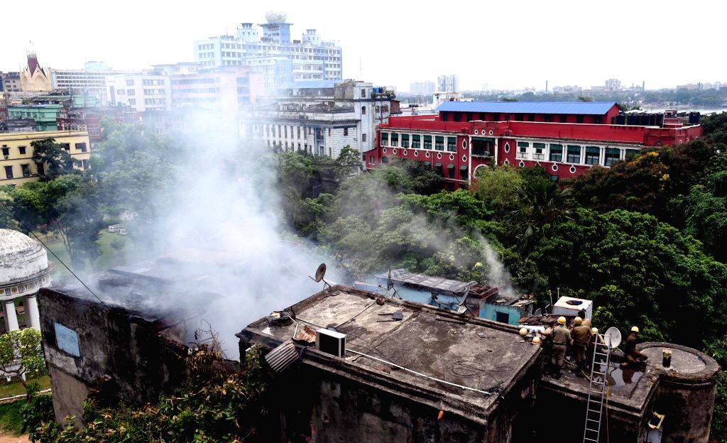 Firefighters try to extinguish the fire after fire broke out at a building
