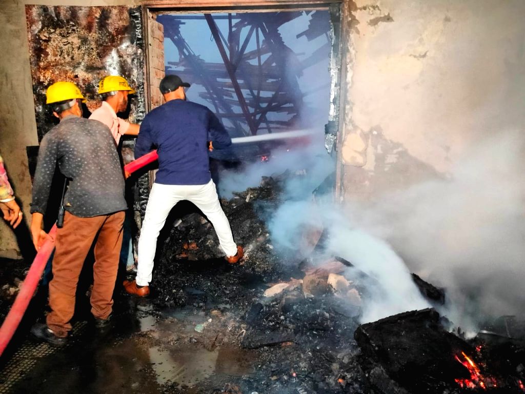 Firefighters trying to douse the fire after it broke out at Aanam Theatre