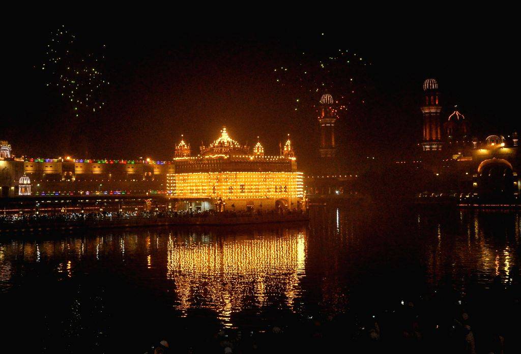 Fireworks light up the sky above the Golden Temple during the ...