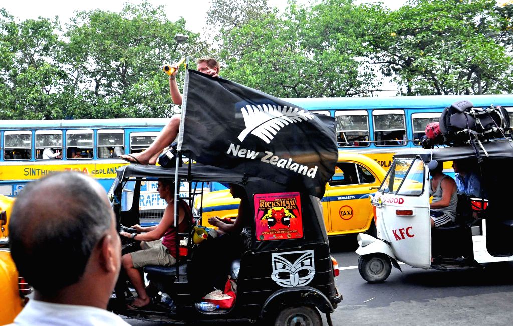 Tourists enjoy auto rickshaw ride