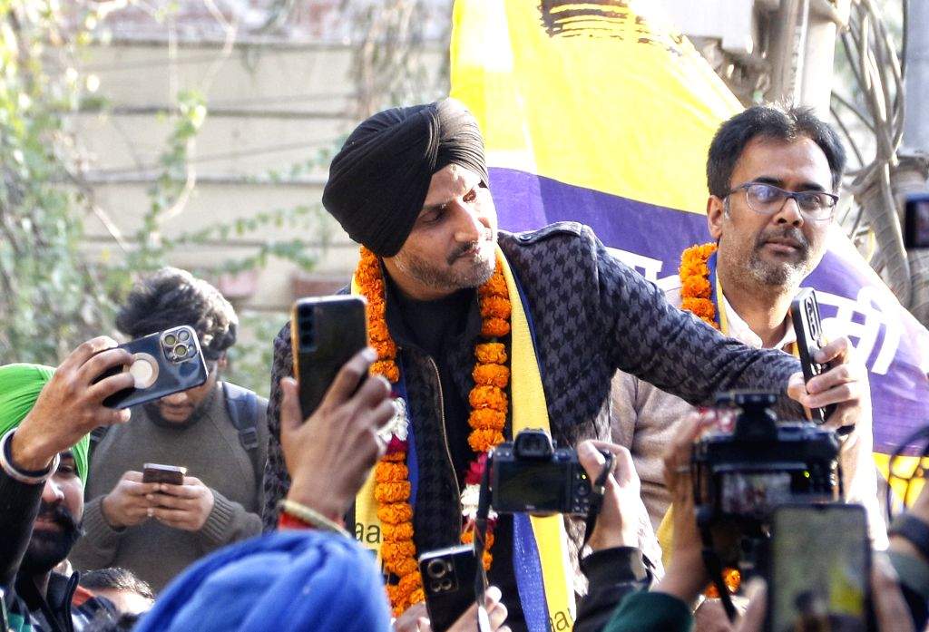 Former Indian cricketer and AAP Rajya Sabha MP Harbhajan Singh leads a ...