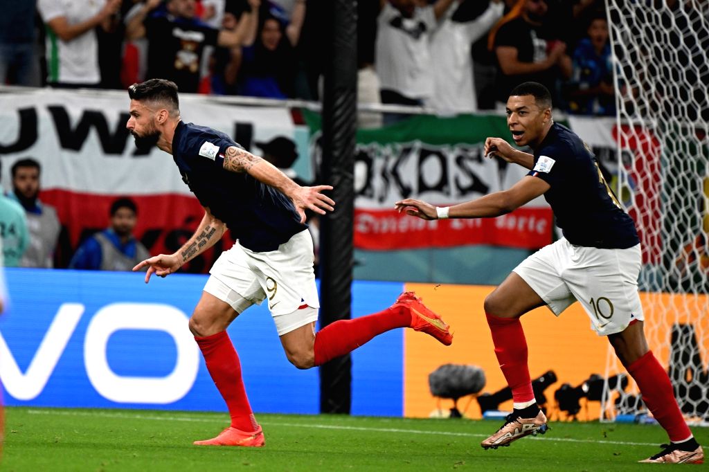 :Doha:France's Olivier Giroud, celebrates with teammate Kylian Mbappe ...