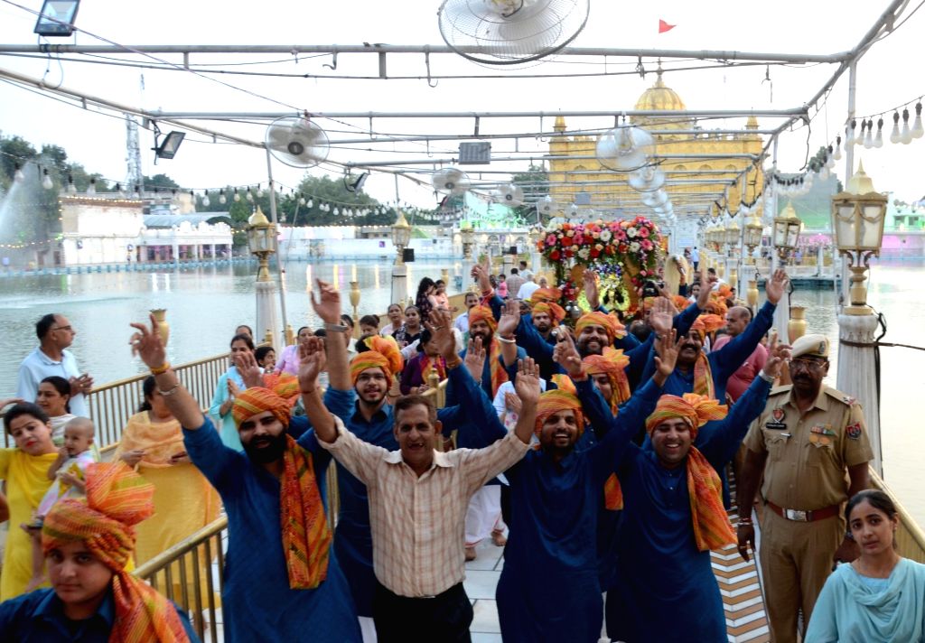 Hindu Devotee take part in a religious procession.