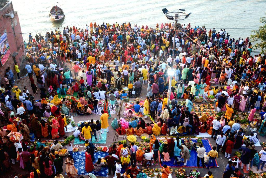 Perform Rituals Kolkata : Devotees perform rituals during 'Chhath Puja' festival