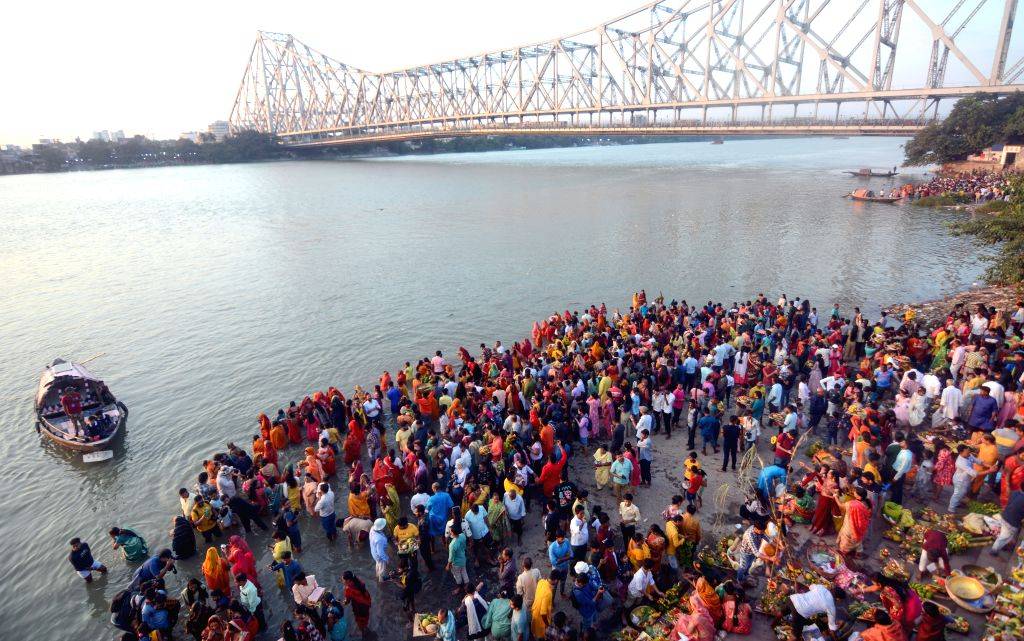 Perform Rituals Kolkata : Devotees perform rituals during 'Chhath Puja' festival