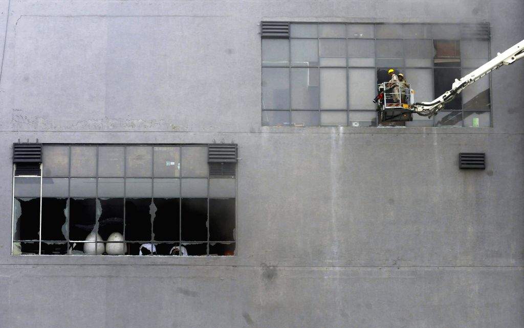 Kolkata : Firefighters try to douse a fire after it breaks out at a ...