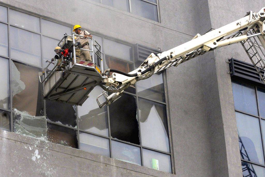 Kolkata : Firefighters try to douse a fire after it breaks out at a ...