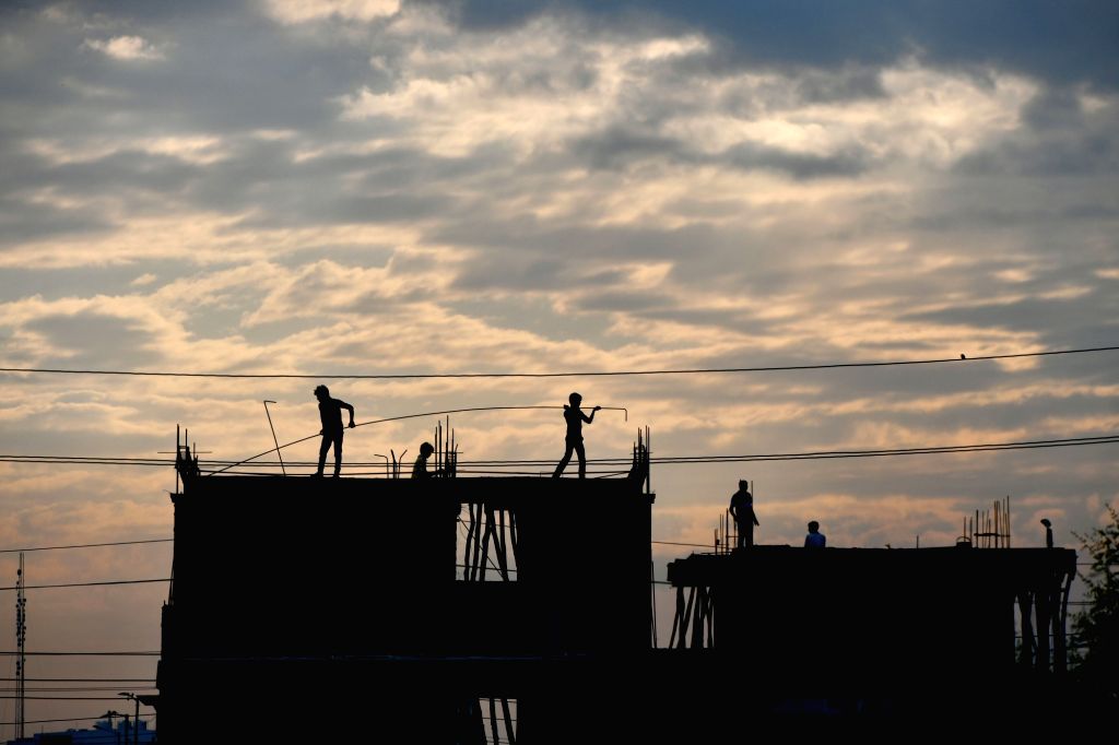 Labourers busy working at construction site