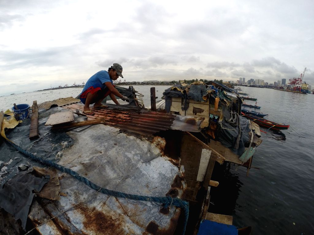 Typhoon Rammasun at a slum area in Manila, the Philippines