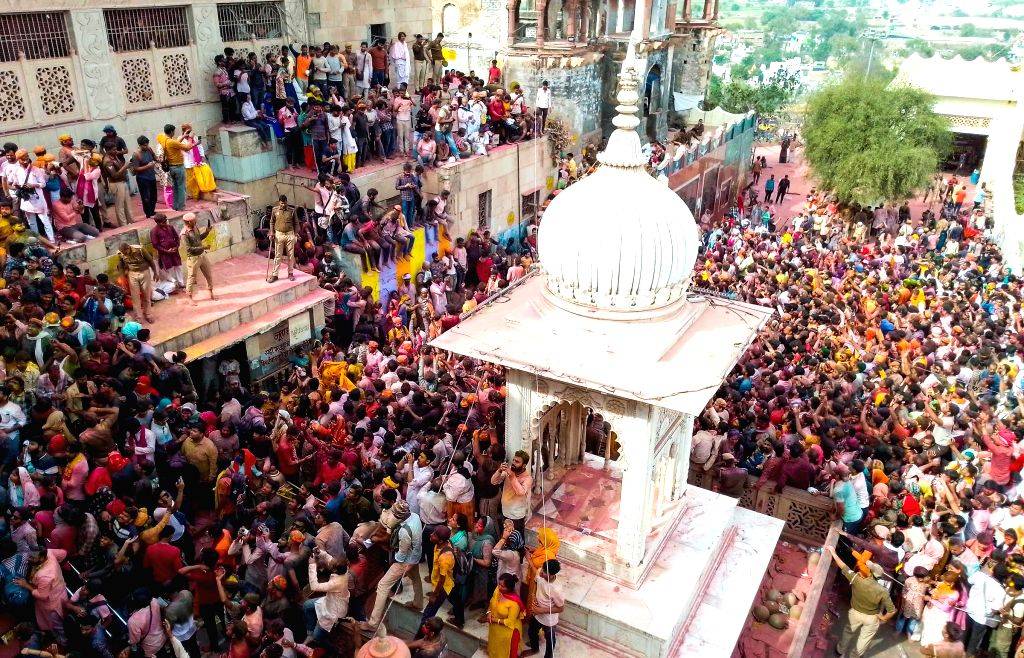 Radha Rani Mathura Mathura : Devotees play Laddoo Holi at Shri Radha Rani Temple in Barsana