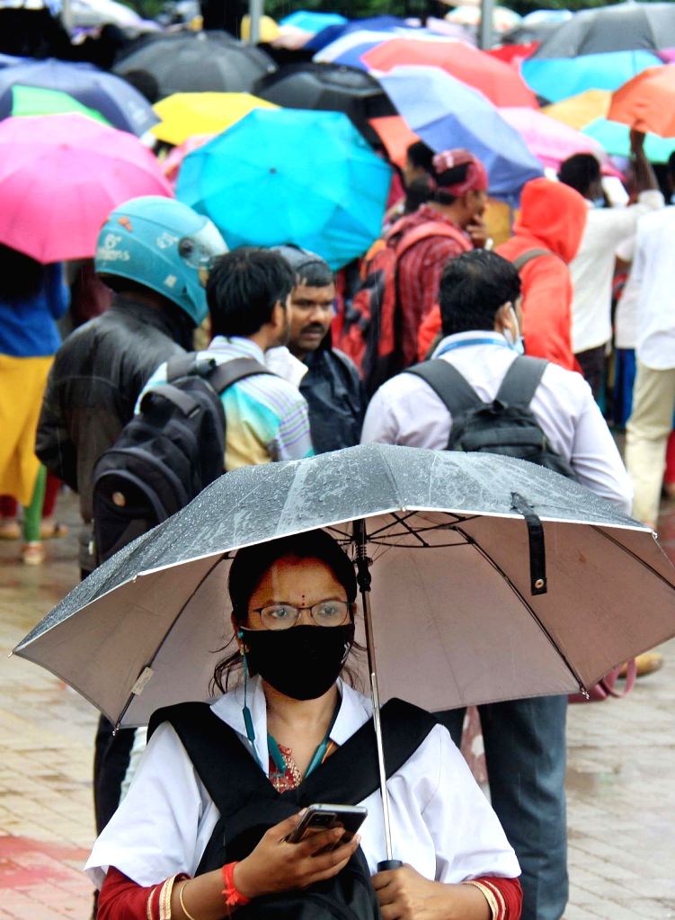 Paramedical workers during rain protest demanding permanent jobs