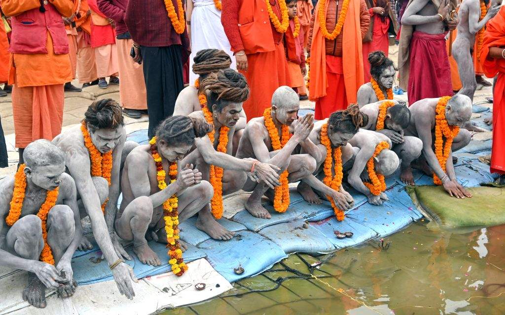 Naga Sadhus (holy men) perform rituals at Triveni Sangam,
