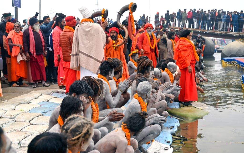 Naga Sadhus (holy men) perform rituals at Triveni Sangam,