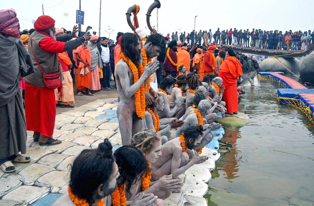 Naga Sadhus (holy men) perform rituals at Triveni Sangam,
