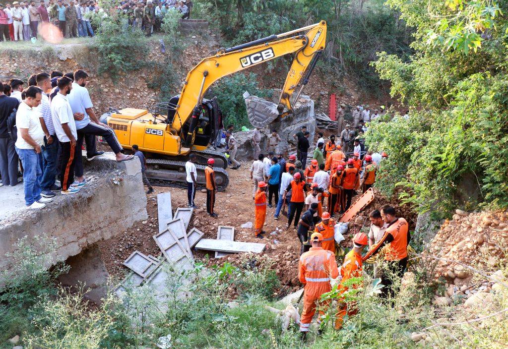 NDRF personnel conduct rescue operation after bridge collapse