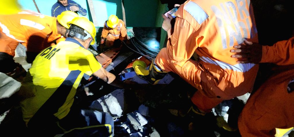 Ndff Rescue NDRF personnel durig a Rescue and relief operation after a Building ...