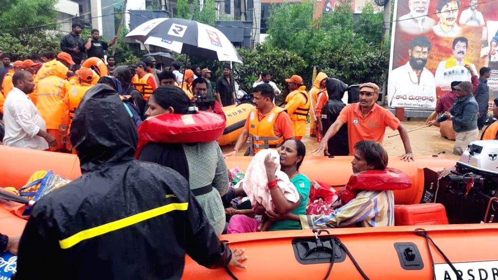 Ndrf While Rescuing NDRF team carries out rescue and relief operations in flood-hit areas