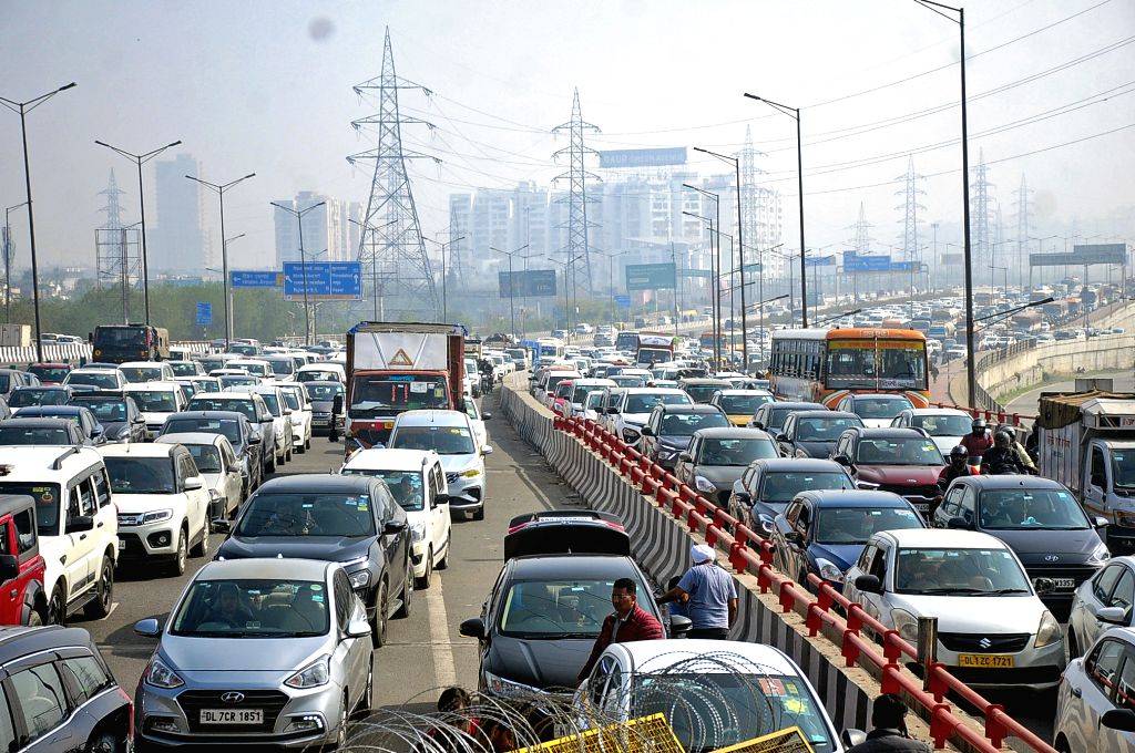New Delhi : Vehicles stuck in a traffic jam near Gazipur Border in view ...