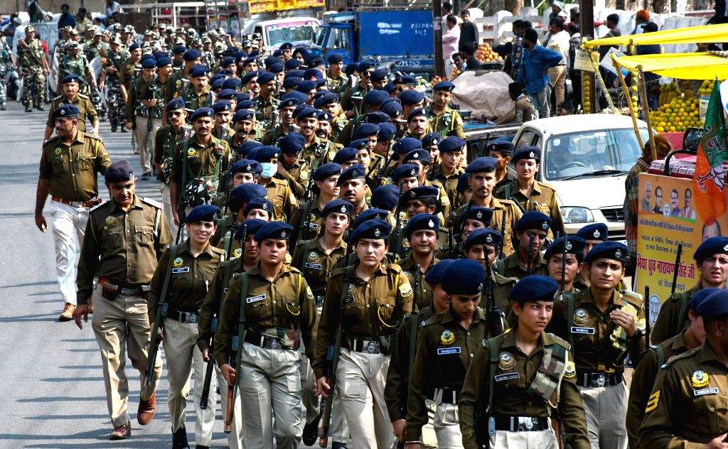 Paramilitary force personnel conduct a flag march ahead of the Assembly ...