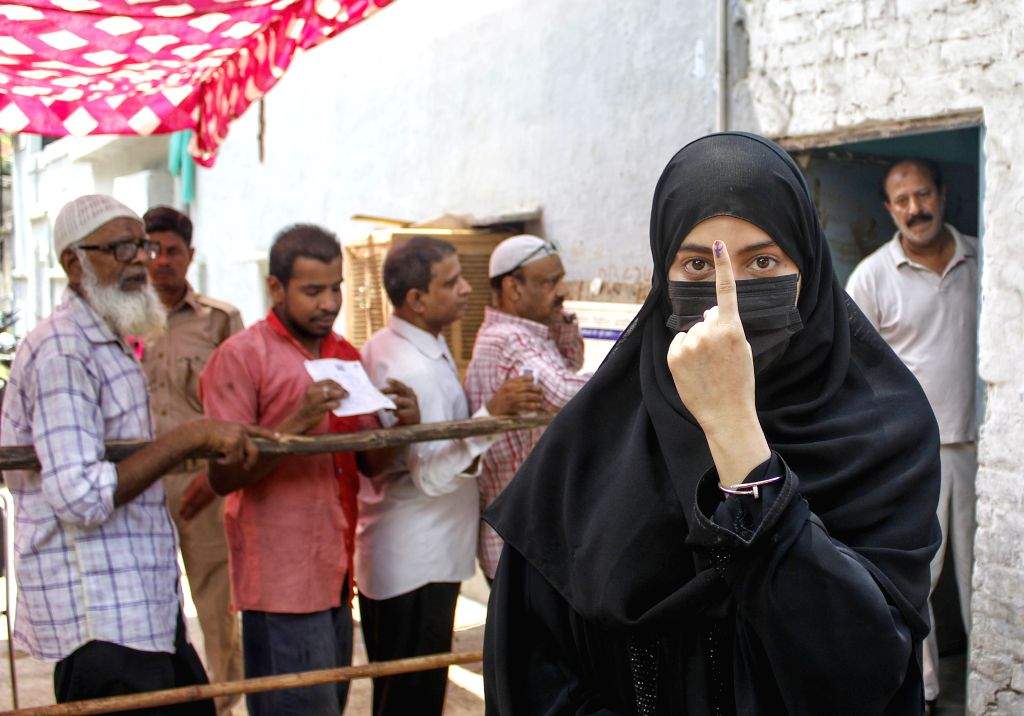 People cast their votes in the sixth phase of Lok Sabha elections in ...