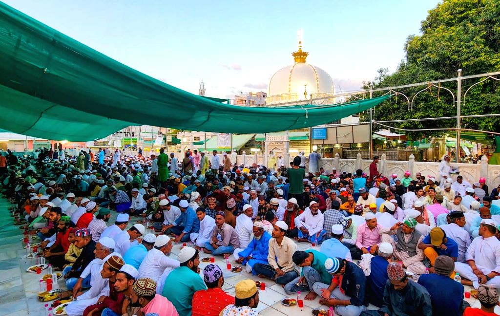 People from Muslim Community break their fast during the first iftar