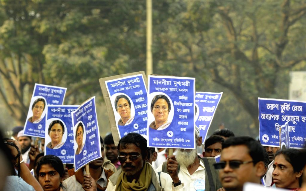 People participate in International Minority Rights Day rally