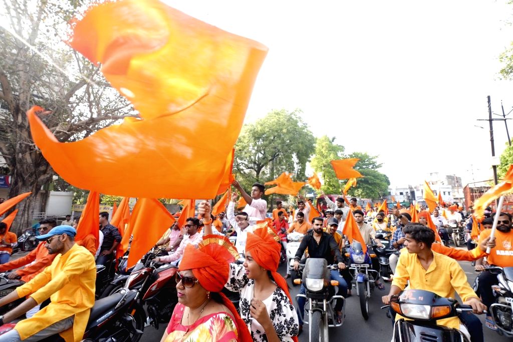 People take part in a bike rally on the occasion of Ram Navami