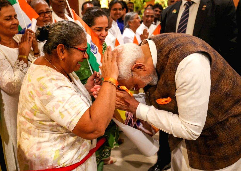 PM Narendra Modi receives a warm welcome from members of the Indian ...