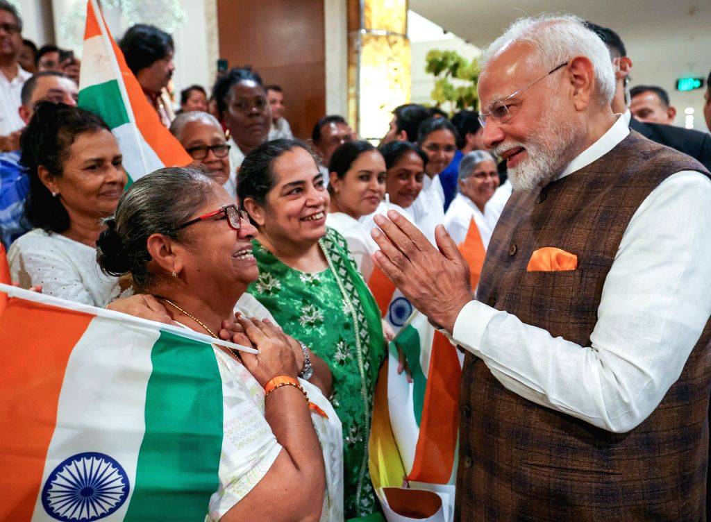 PM Narendra Modi receives a warm welcome from members of the Indian ...